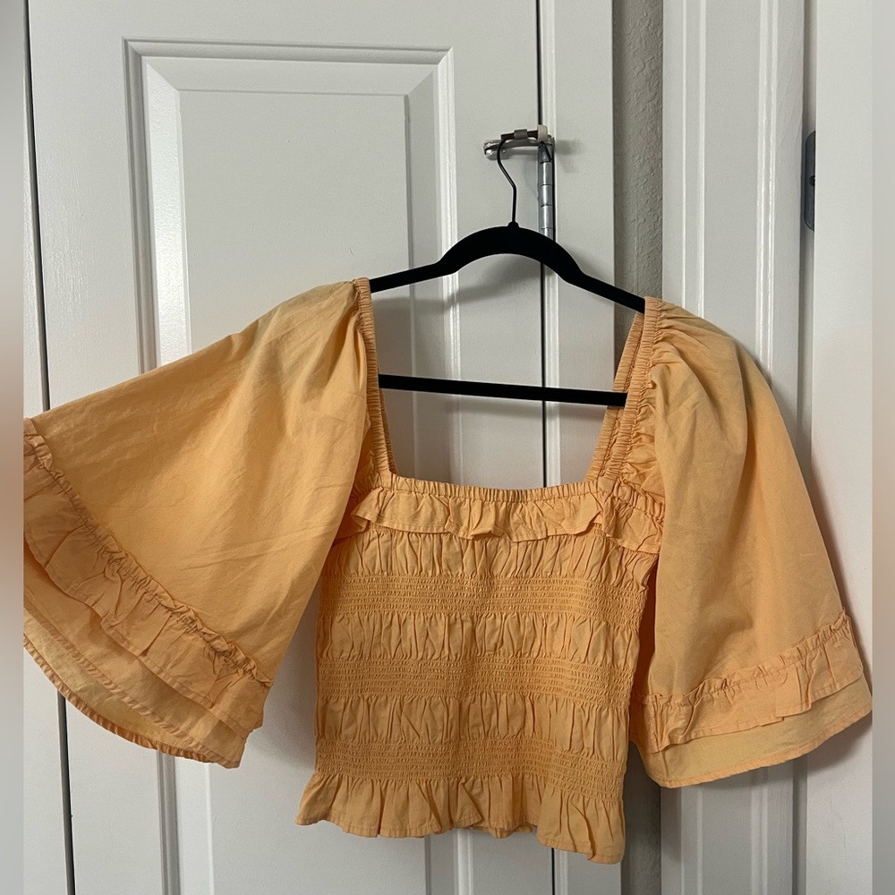Free people orange blouse with sleeves size medium